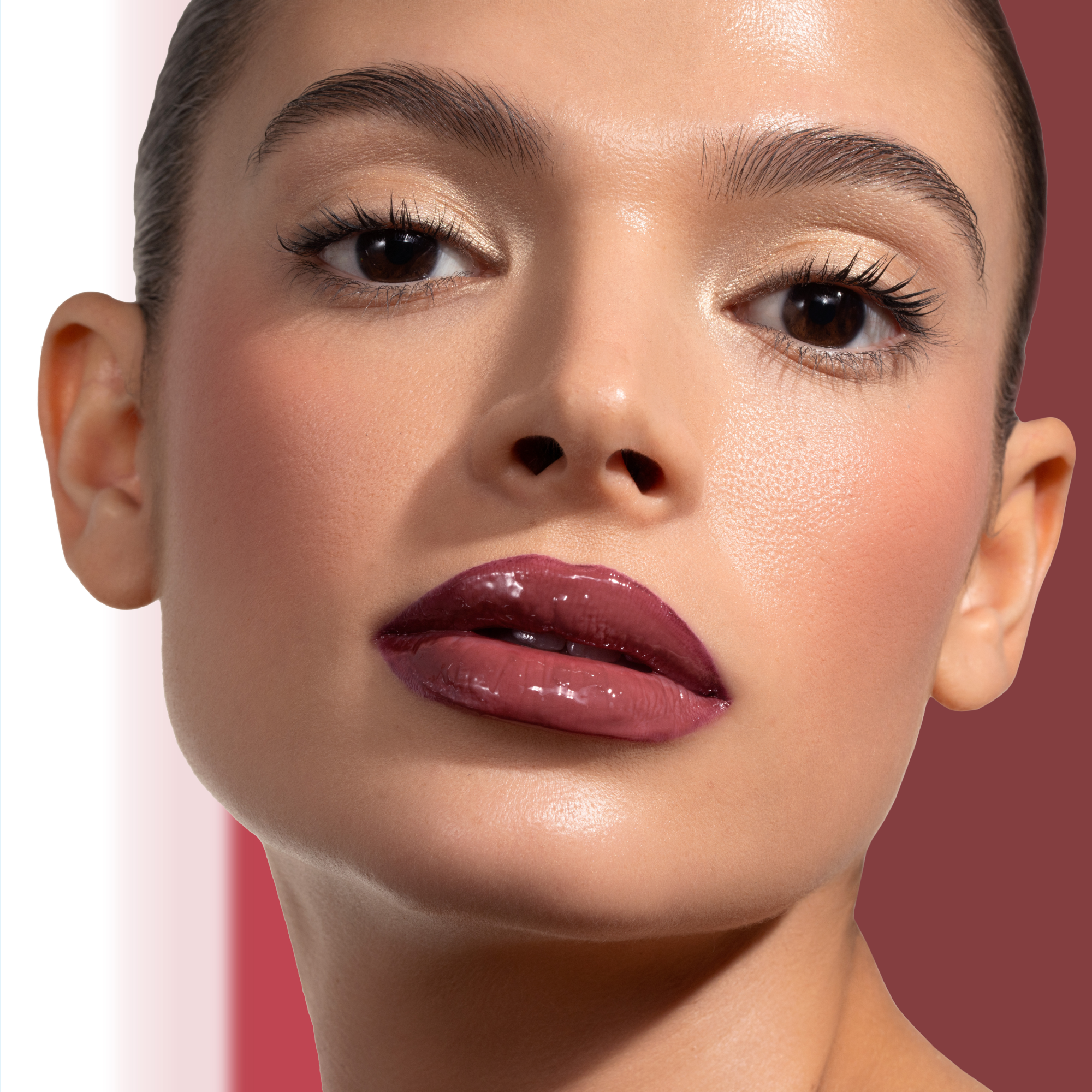 HY-GLOSS in shade 'Cherry Cola' model look on a mauve and white background.